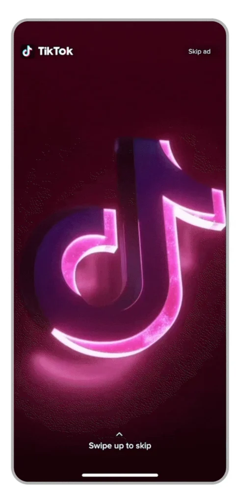 Anúncio TopView no TikTok Ads Anúncio animado do TikTok exibindo o formato TopView com logotipo iluminado em tela de smartphone